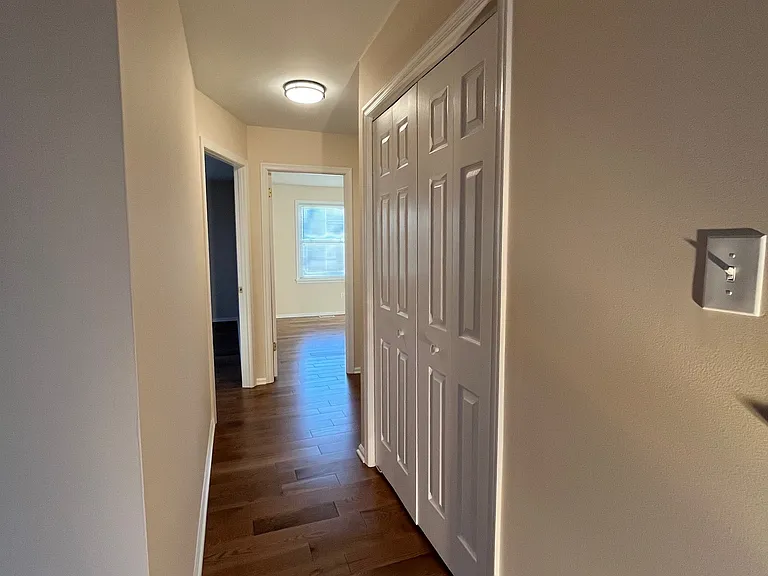 Hallway To Bedrooms With Closet