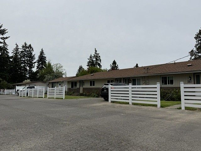 Front of Duplex, there is room for 1 car in driveway with additional parking on other side of main driveway/road