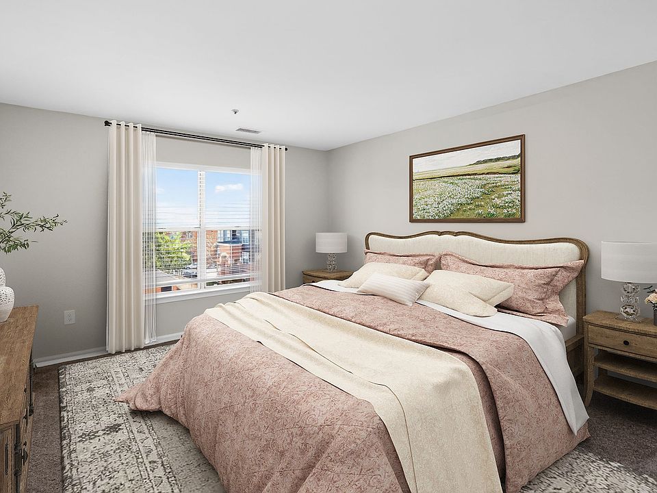 Elevate your living at Eagle Rock Apartments at Columbia Pike. This beautifully designed bedroom offers a serene retreat with stunning views. Enjoy modern amenities and a vibrant community. Schedule your tour today to find your perfect home!
