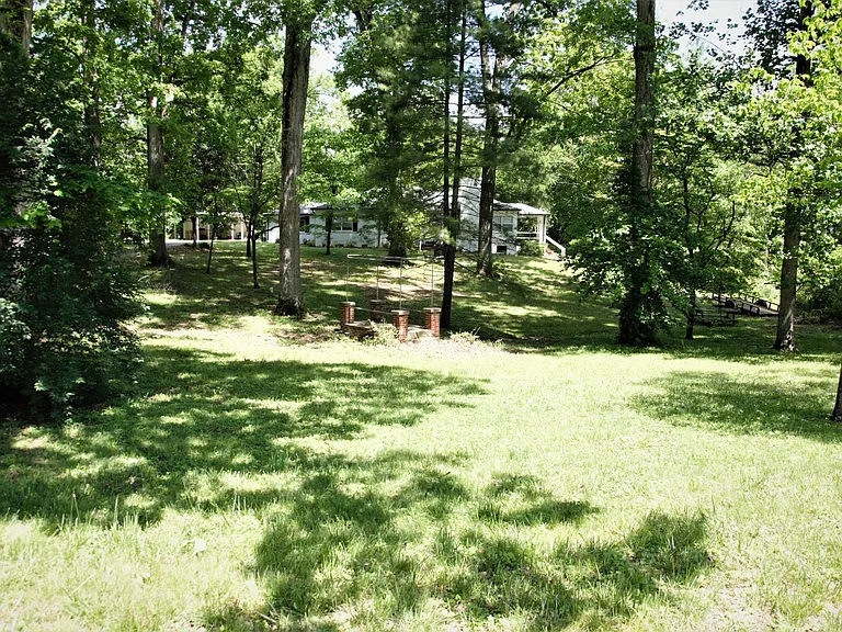 Immense front yard, 1.24 acre property, one of the largest in the area. Lawncare is included with rent!