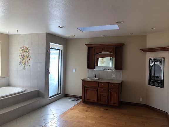 His sink master bath with fire place