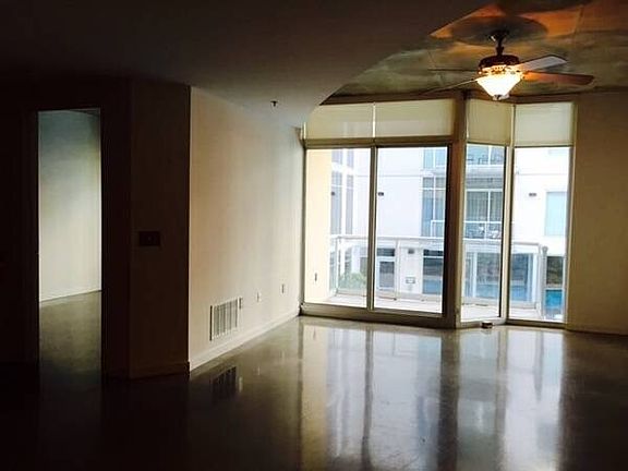 living room overlooking pool and courtyard