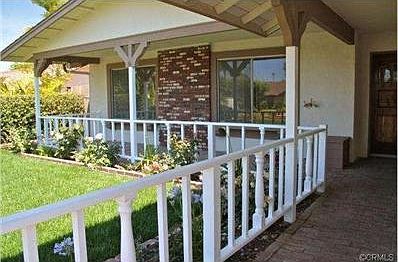 Great curb appeal with a brick front walk and covered porch.