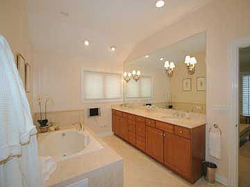 Master bath with marble, maple vanity
