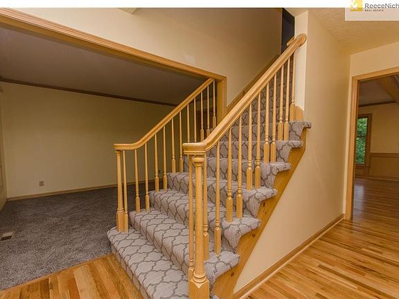 Brand new patterned carpeting on the stairway adds variety and texture to the home.