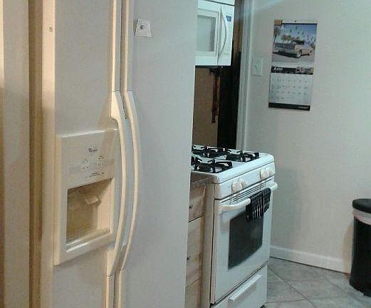 Ice making fridge and gas stove.