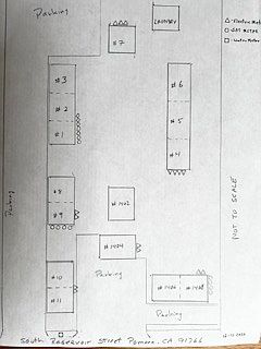 Unit 7 is a detached building at the center rear of the property adjacent to the laundry room
