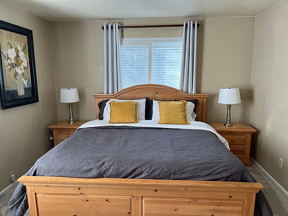 King size bed with two nightstands, dresser, closet and washer & dryer in second closet.