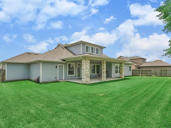 The large backyard features a huge covered patio and is the perfect place to relax and entertain! There is lots of green space for the kids to play or plenty of room for that new pool! Make this your new backyard Oasis!