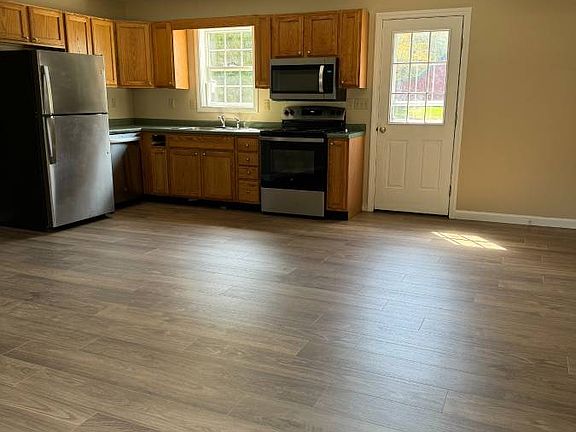Main level kitchen / dining view from living room space