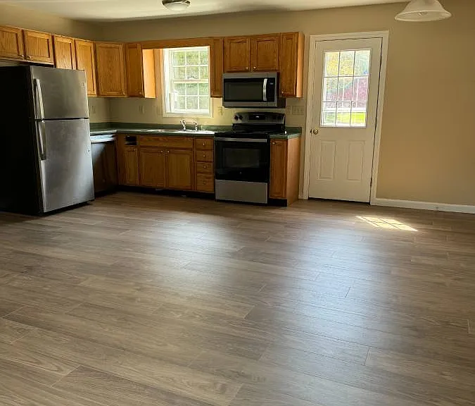 Main level kitchen / dining view from living room space