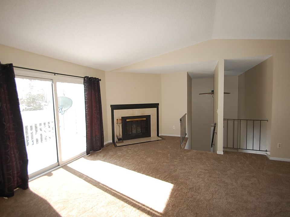 Vaulted living room with woodburning fireplace