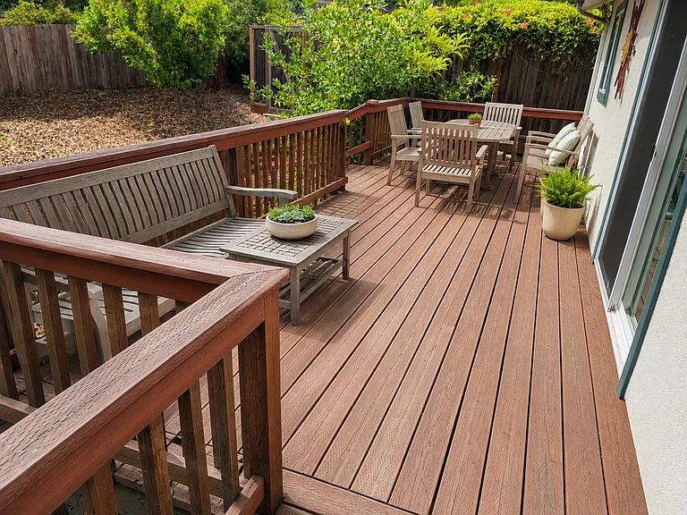Deck has a staircase down to the yard, access through a sliding door to the breakfast nook, or wraps around to the front door.