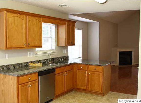 Medium color cabinets and stainless appliances