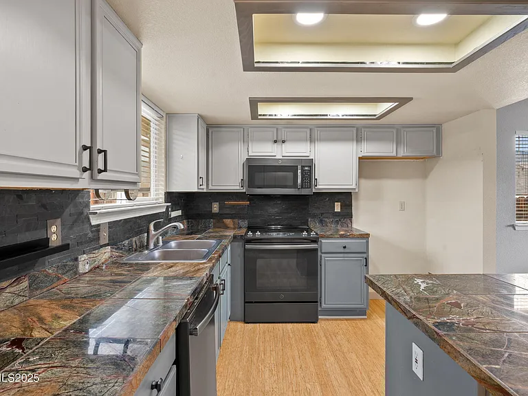 Kitchen Countertops with plenty of cabinets. Space for 36" Refrigerator
