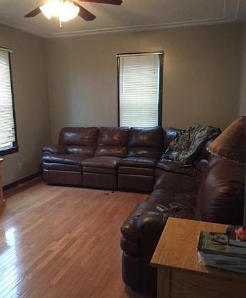 Main level living room with hard wood floors.