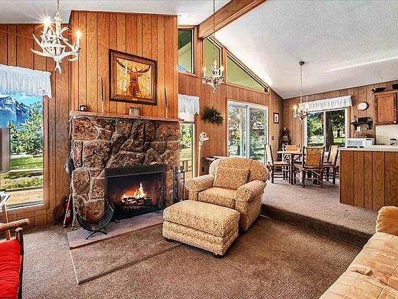 Livingroom with fireplace and TV. (Sofa and chair have been replaced with equal furniture)