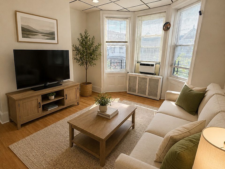 Living room virtually staged. Currently empty