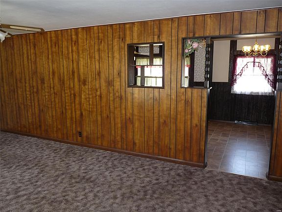 View from entry into kitchen through living room.