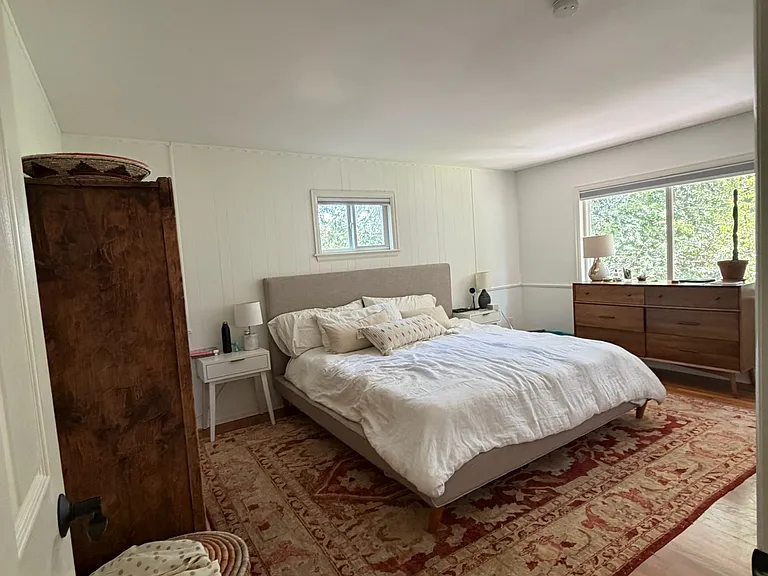 Second story spacious primary bedroom overlooking the backyard