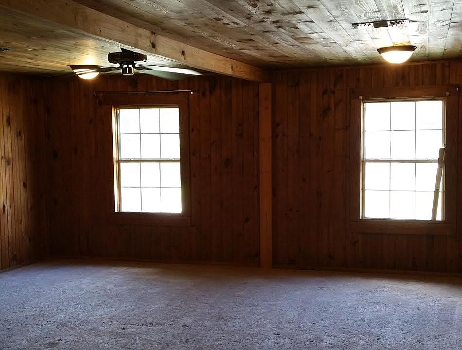 large living room with tongue and groove paneling