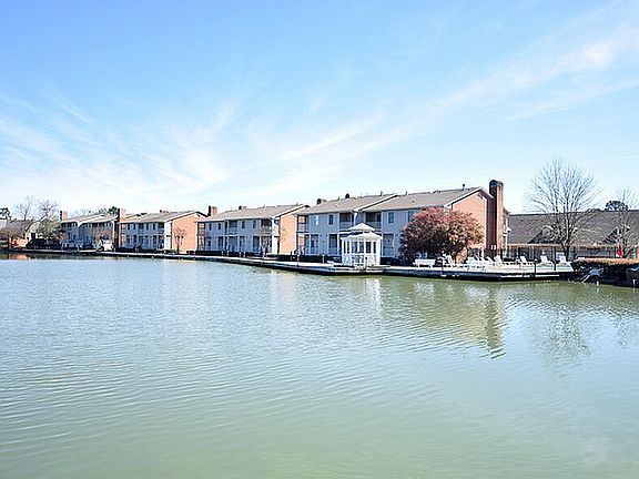 Enjoy the tranquility of lakeside living with these charming townhouses.