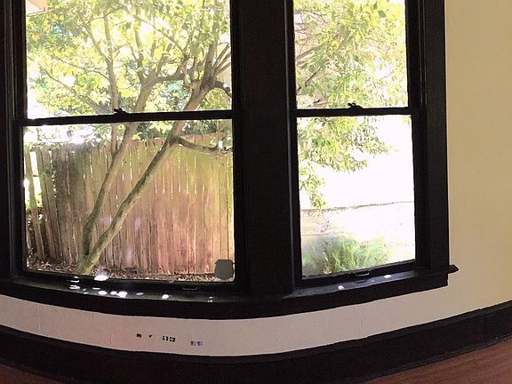 Living room panorama. Front door to the left, south-side win