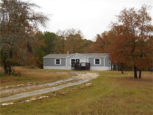 Front of home from street view, sits on 5 acres of land