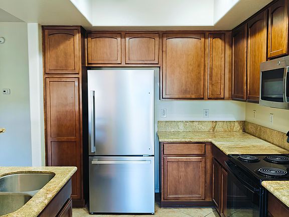 Remodeled kitchen with granite countertops and breakfast bar.