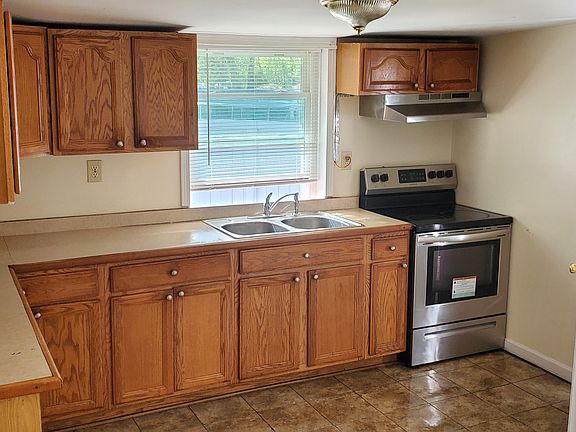 Kitchen with electric stove.