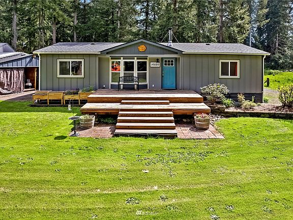Massive three level deck with sidewalk from right side of the home to the front door. Additional parking on the right also for 2-3 cars.
