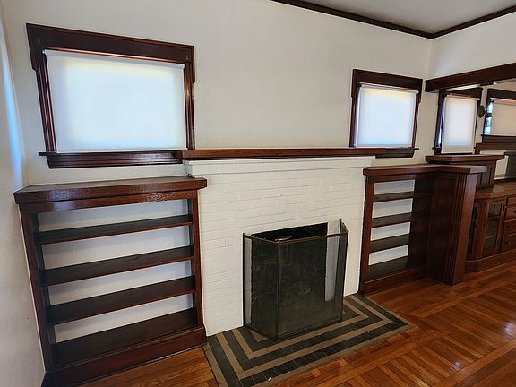 Decorative fireplace and built-in bookshelves