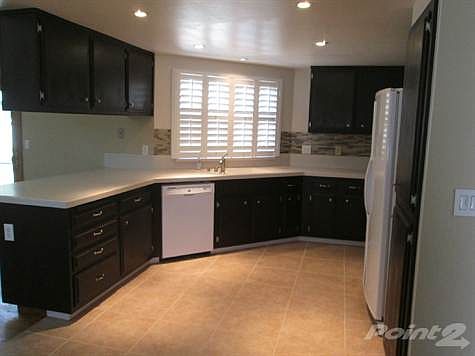 Upgraded Kitchen with Tile Flooring and Can Lighting