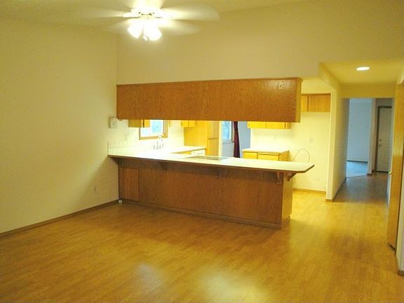 Family room off kitchen with ceeling fan