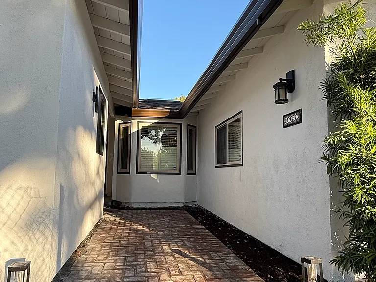 Common front walkway leading to the front door.