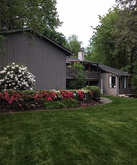 Back yard. Exterior w/ 2 Decks: Main home above and mother-in-law apartment / ADU bottom right. 

(Home has been repainted white since this photo was taken)