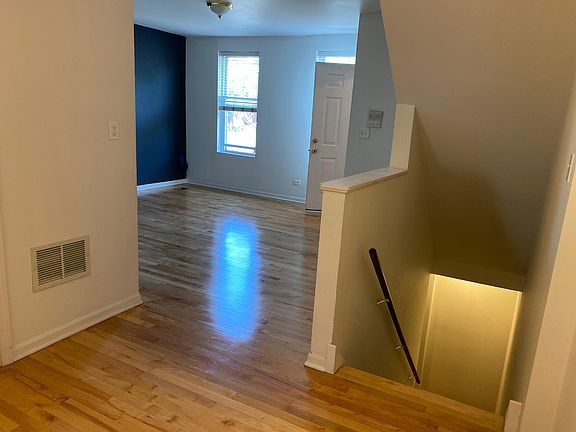 From staircase down, toward living room