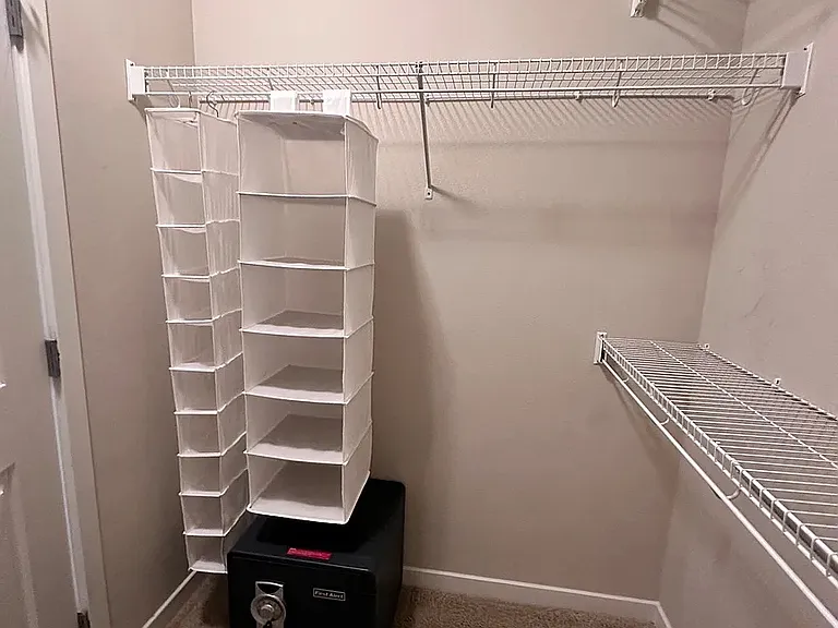Walk in closet with safe left side