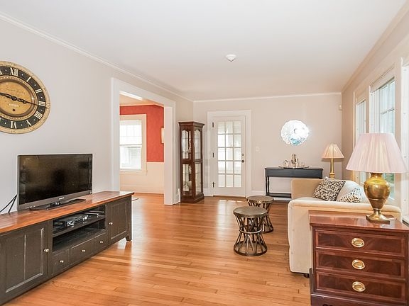 Living Room leads to Dining Room and Sun Room