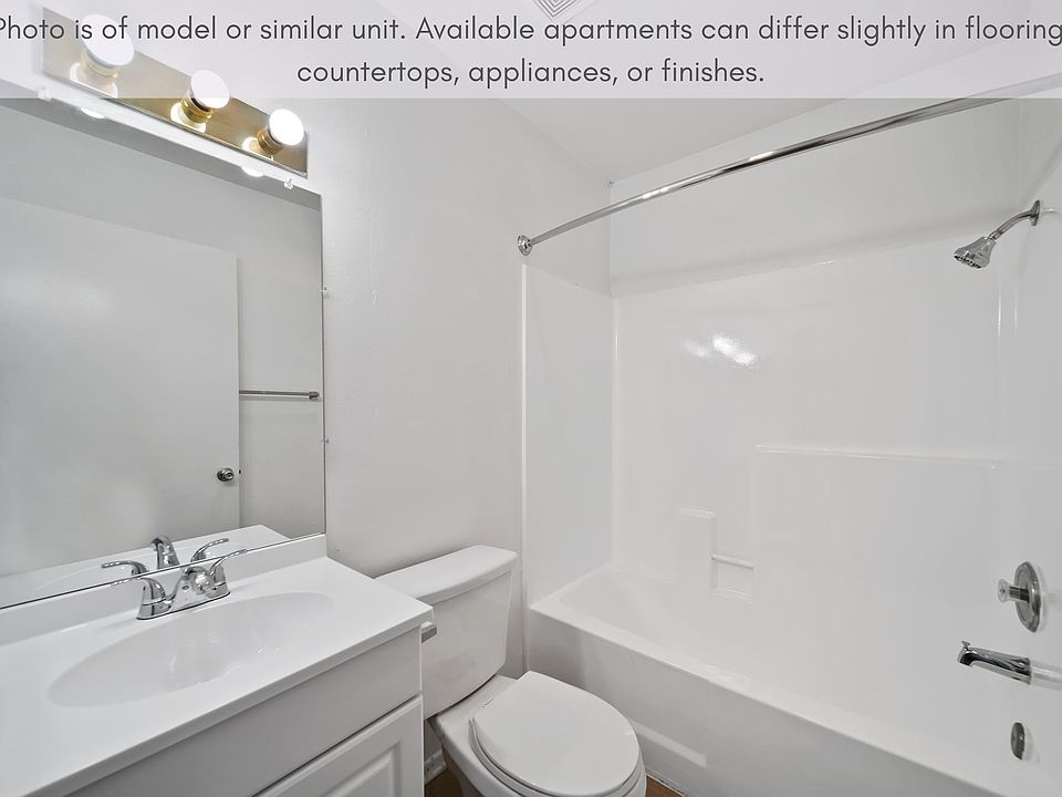 Bright bathroom with a full tub and generous counter space for everyday use.
