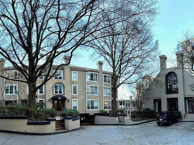 front of building with view of clubhouse at right