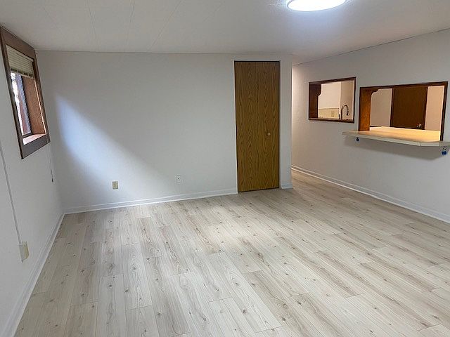 Great room with good light and storage.