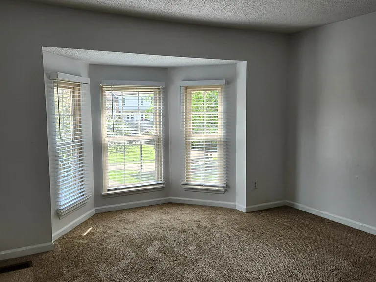 Second bedroom has bay windows.