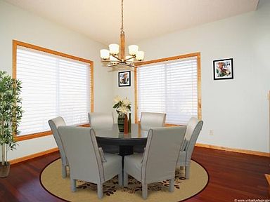 Formal Dining Room or Office or Sitting Room has Cherry wood floors and is bright and sunny