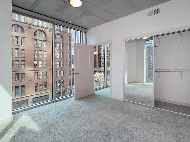 Carpeted Bedroom with Floor-to-Ceiling Windows