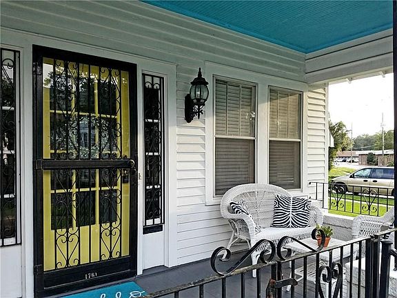 Glass storm door allows light in and heat or cold out.