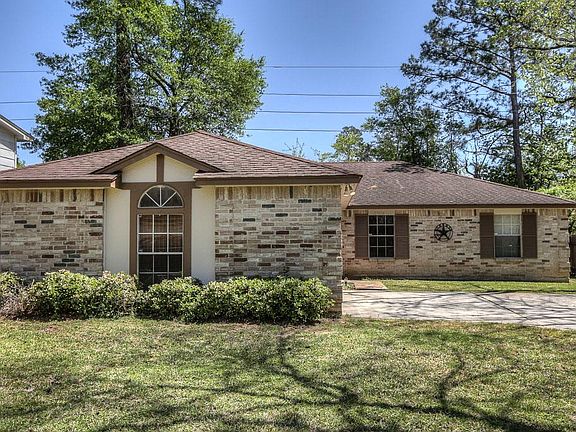 Beautiful trees are a welcome back drop for this updated home.