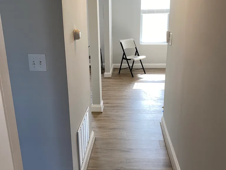 turning the corner to the living/dining room and kitchen in the rear or the house