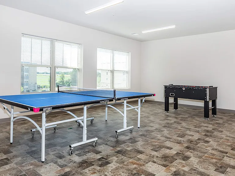 Game room featuring table tennis and foosball