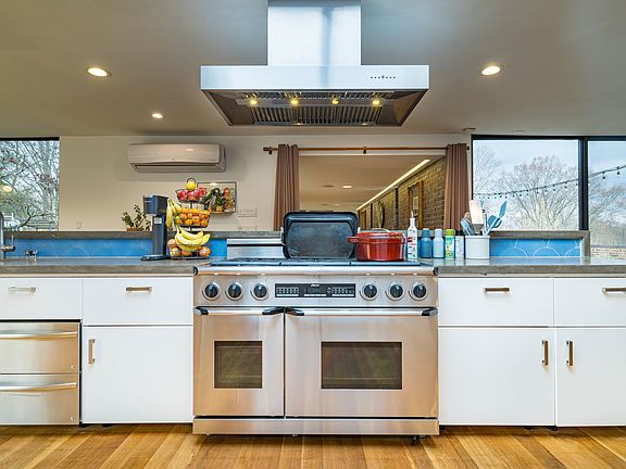 Open kitchen overlooking hall and living room